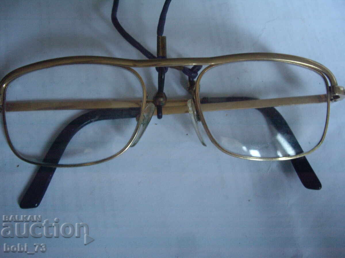 Gold-framed glasses