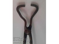Old forged blacksmith tongs with long handles