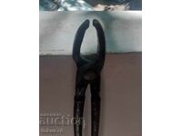 Old forged blacksmith tongs with long handles