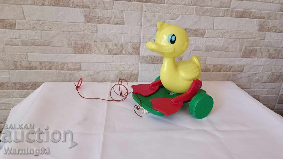 Auction  Duck with wheels - a toy from the socialist era