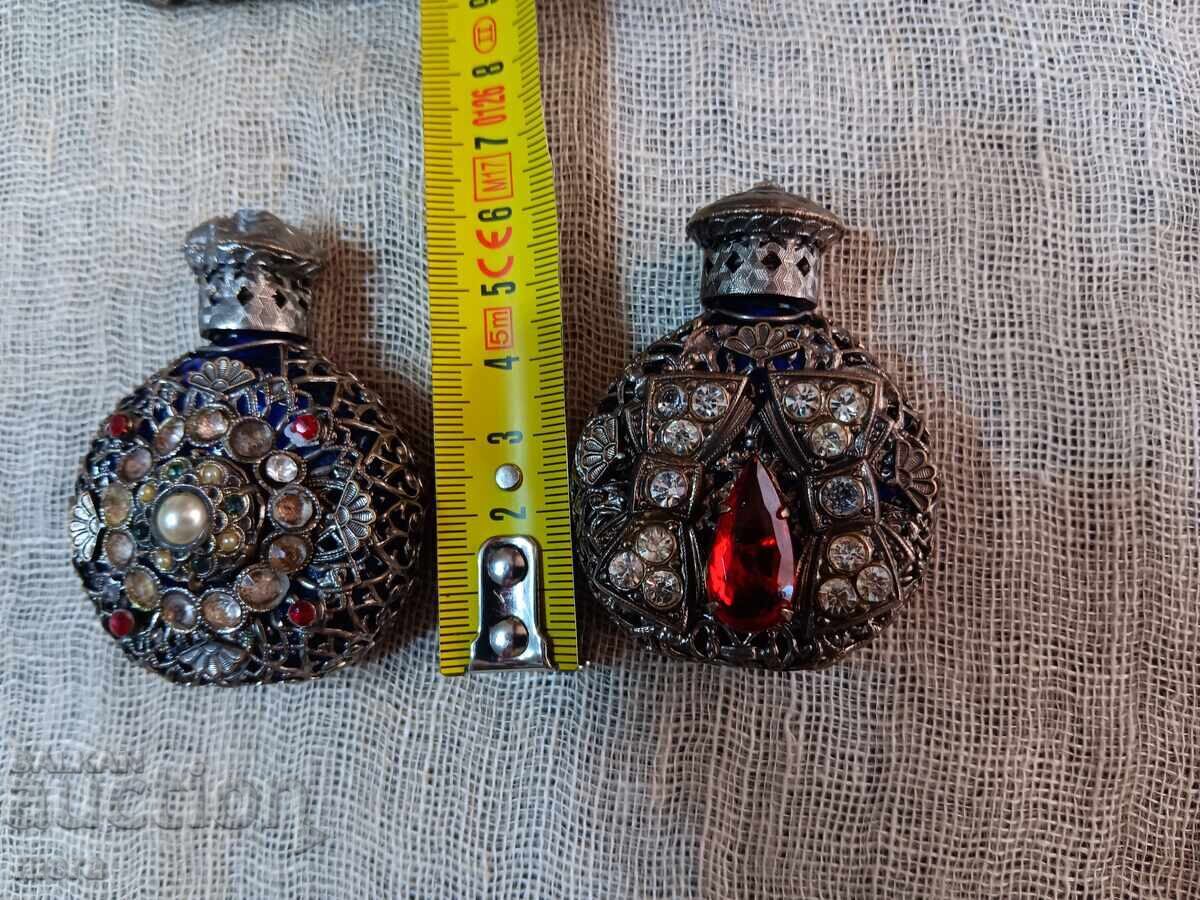 Auction Lot of perfume bottles with metal trim and colored stones Auction Lot of perfume bottles with metal trim and colored stones