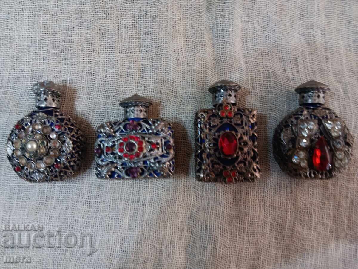 Lot of perfume bottles with metal trim and colored stones Lot of perfume bottles with metal trim and colored stones