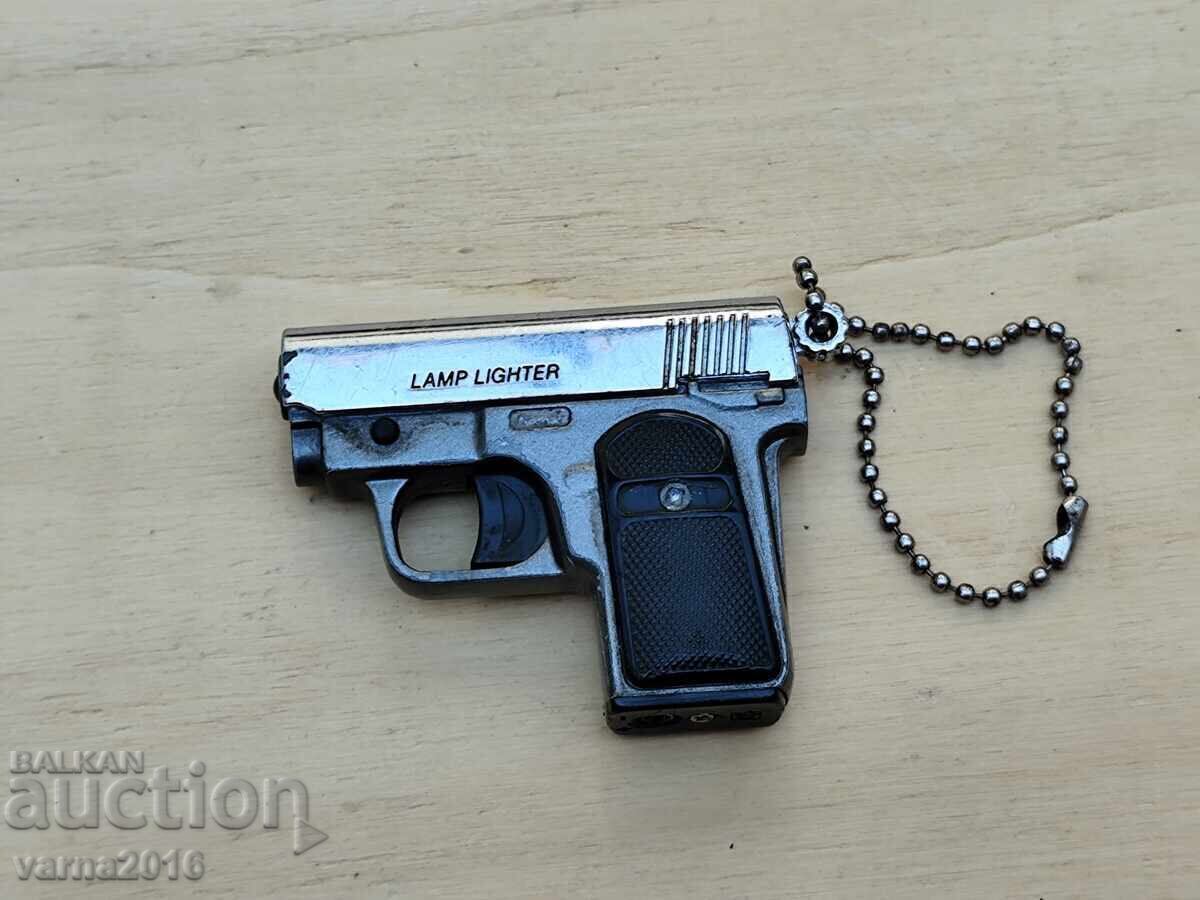 Auction  Gun-shaped lighter - LAMP LIGHTER
