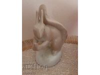 Old porcelain figurine Squirrel with a nut. Russia