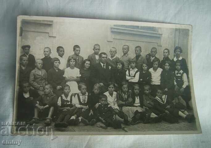 Old photo of students, teacher
