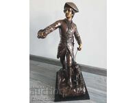 Bronze sculpture/figure of a hunter with a horn and dog