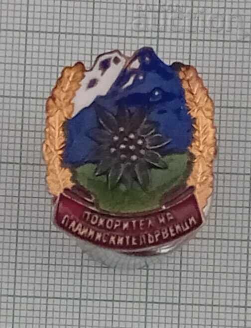 CONQUEROR OF MOUNTAIN PEAKS ENAMEL BADGE