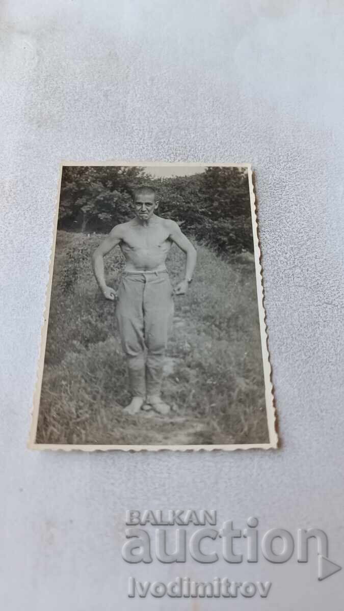 Photo Young man naked to the waist Photo Young man naked to the waist