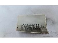 Photo Men women and children in the sea