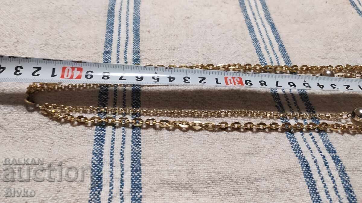 Artistic gold-colored metal necklace - 7