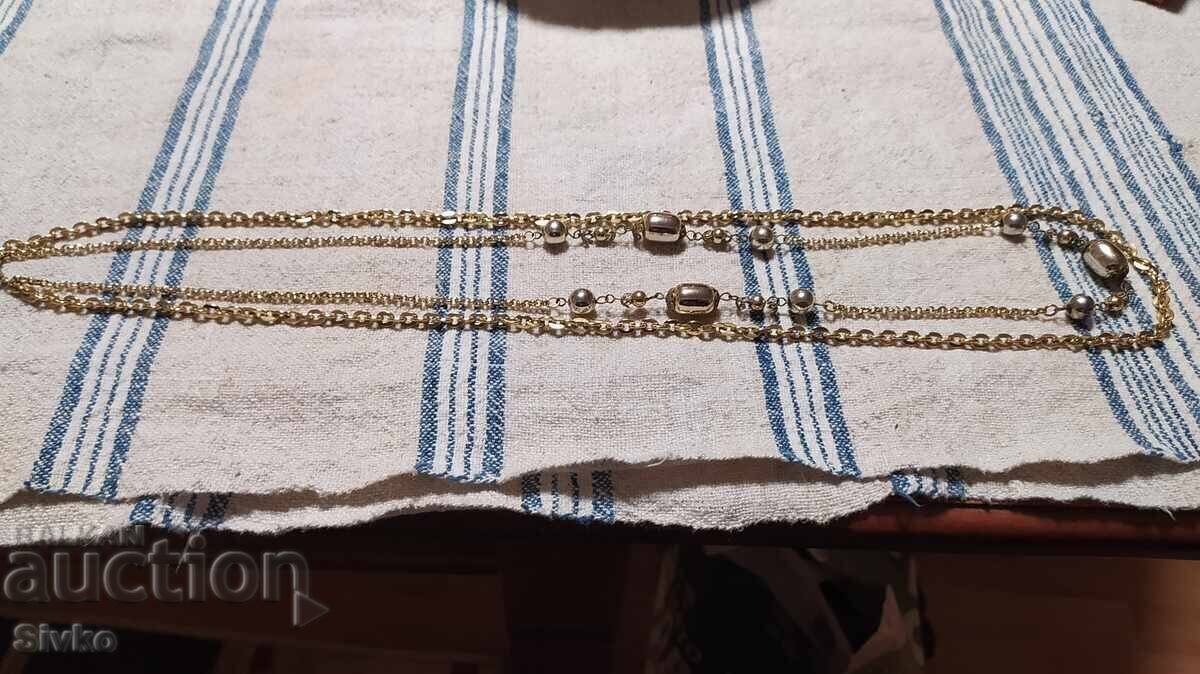 Artistic gold-colored metal necklace