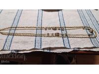 Artistic gold-colored metal necklace