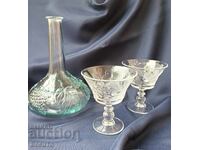 Pressed glass carafe and glasses on a stand with embossed fruit