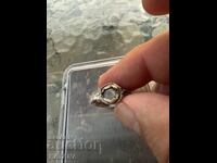 Old silver ring with a stone