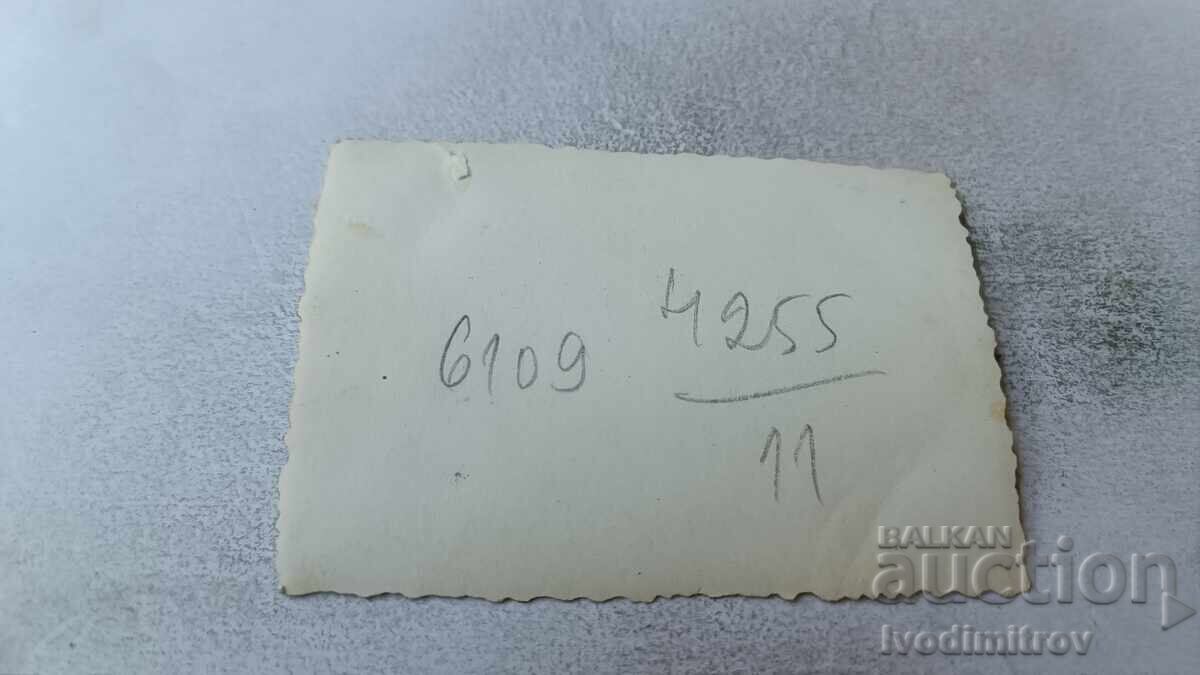 Photo Sofia Woman with a bouquet of flowers on the sidewalk with price 2.35 BGN | € 1.20