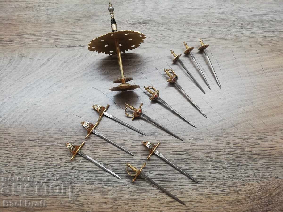 Auction Set Spain Toledo 11 pcs. cocktail sabers, sword, a sword on a stand Auction Set Spain Toledo 11 pcs. cocktail sabers, sword, a sword on a stand