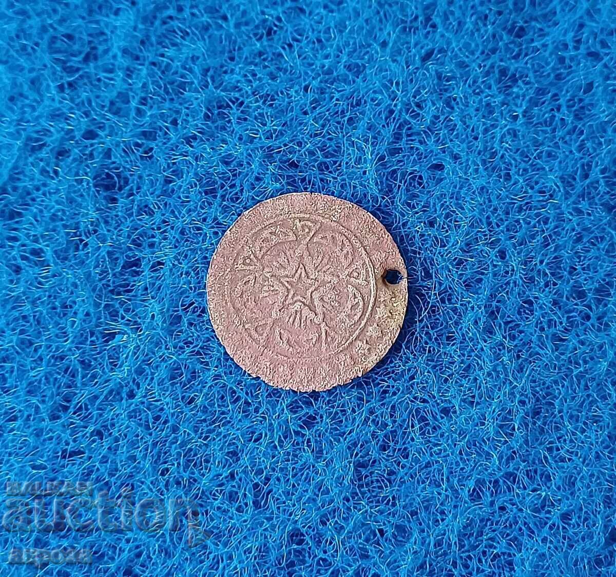 Παλαιό νόμισμα που χρησιμοποιείται ως κόσμημα Παλαιό νόμισμα που χρησιμοποιείται ως κόσμημα