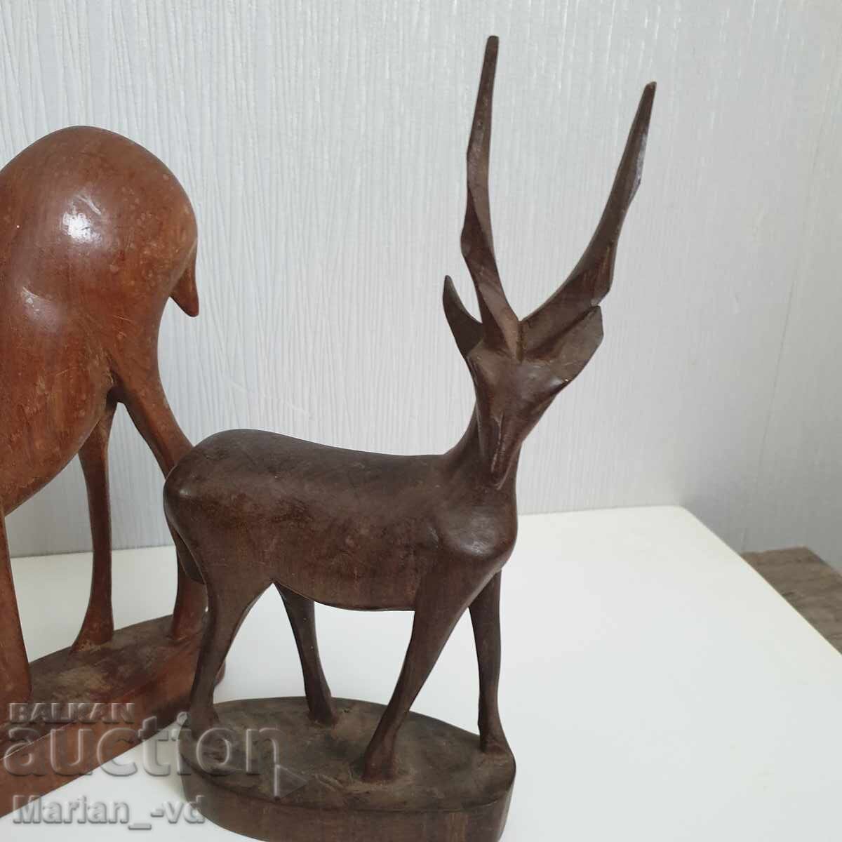 Delivery of Old wooden deer figures