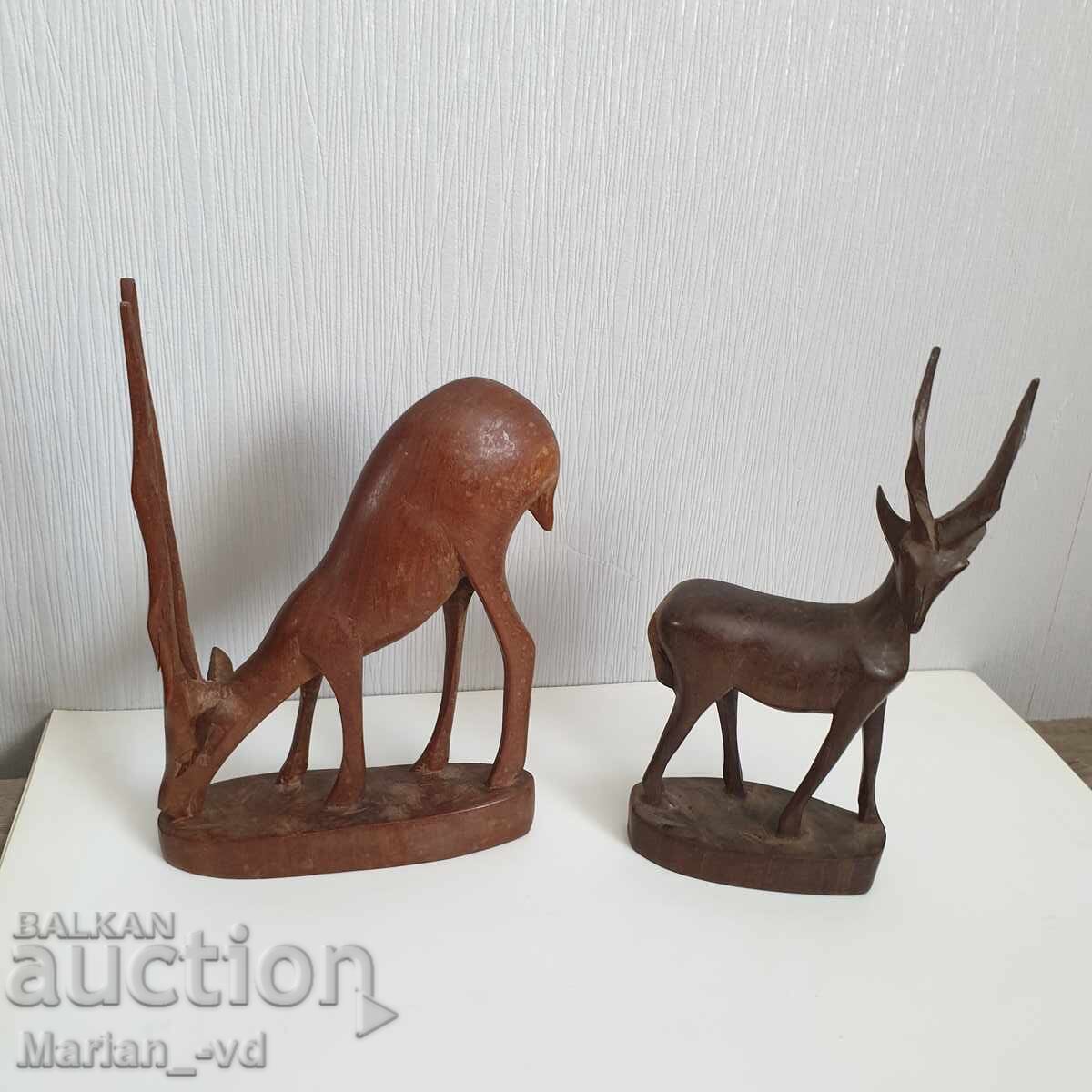 Old wooden deer figures