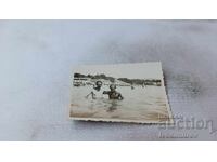 Photo Two men in the sea