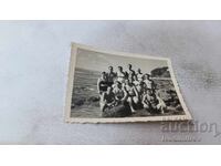 Photo Women and men on the beach