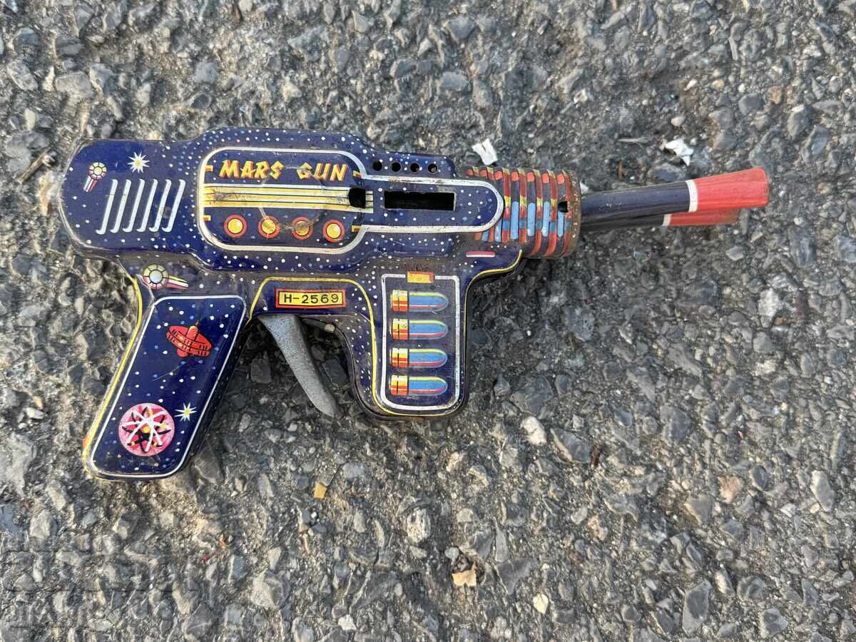 Old metal mechanical toy space gun Old metal mechanical toy space gun