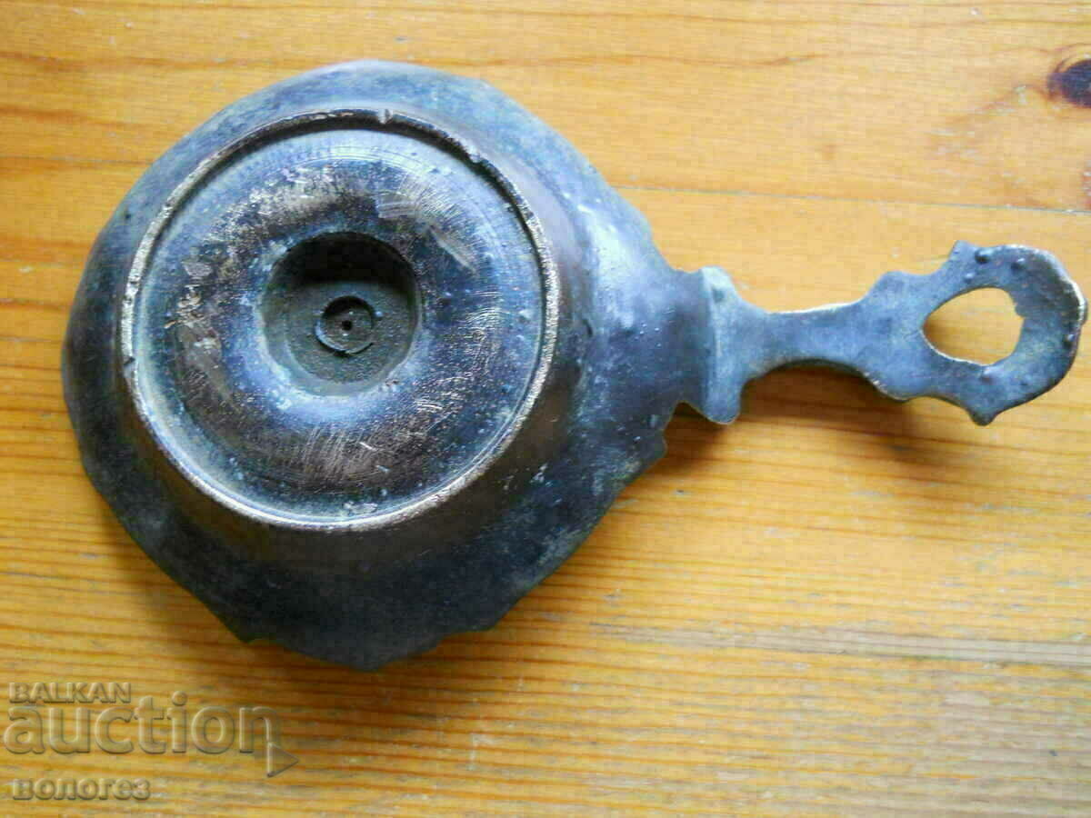 Antique bronze candlestick with price 25.00 BGN | € 12.78 Antique bronze candlestick with price 25.00 BGN | € 12.78