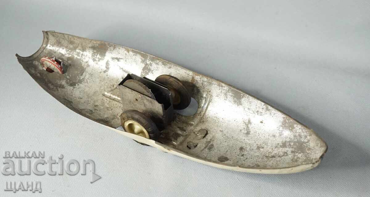 Auction  Motherboard with tires. Old metal toy model boat ship