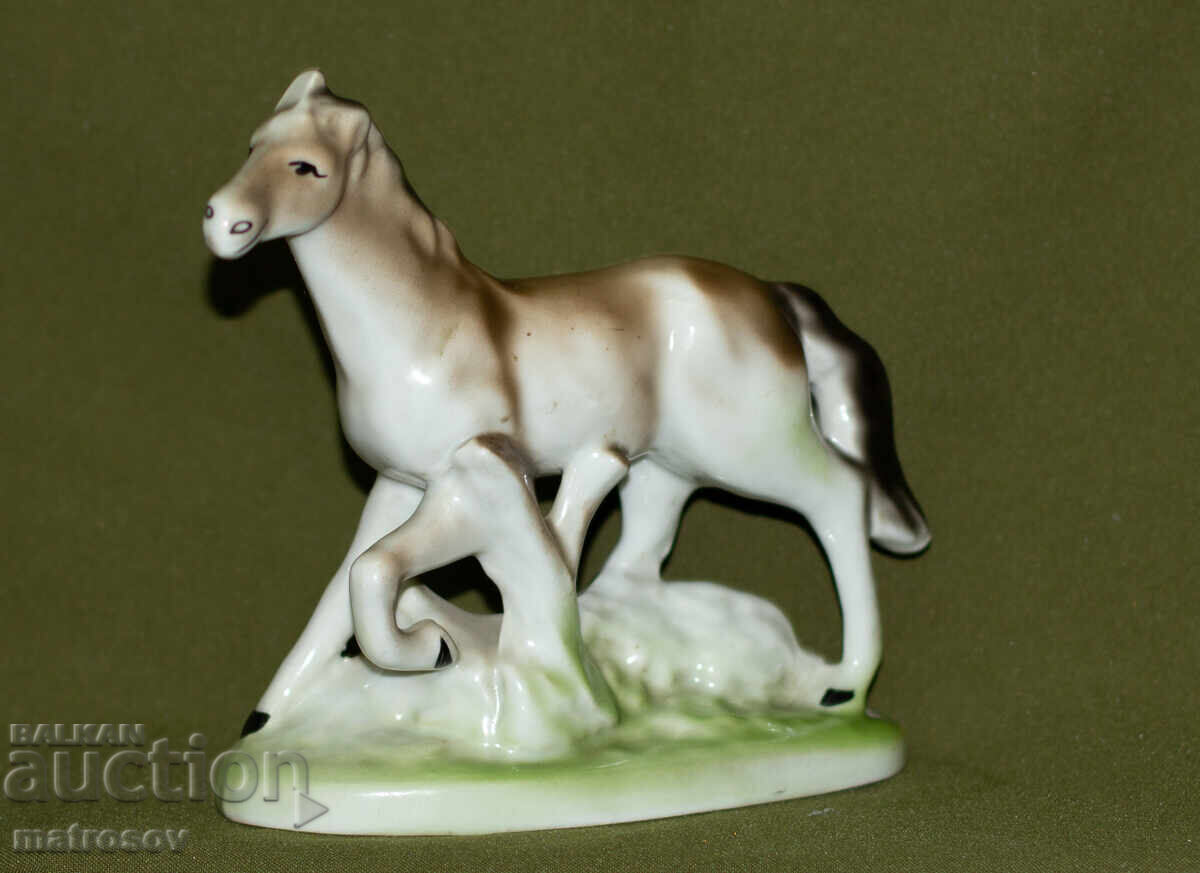 Auction  Decorative porcelain figurine of a galloping horse