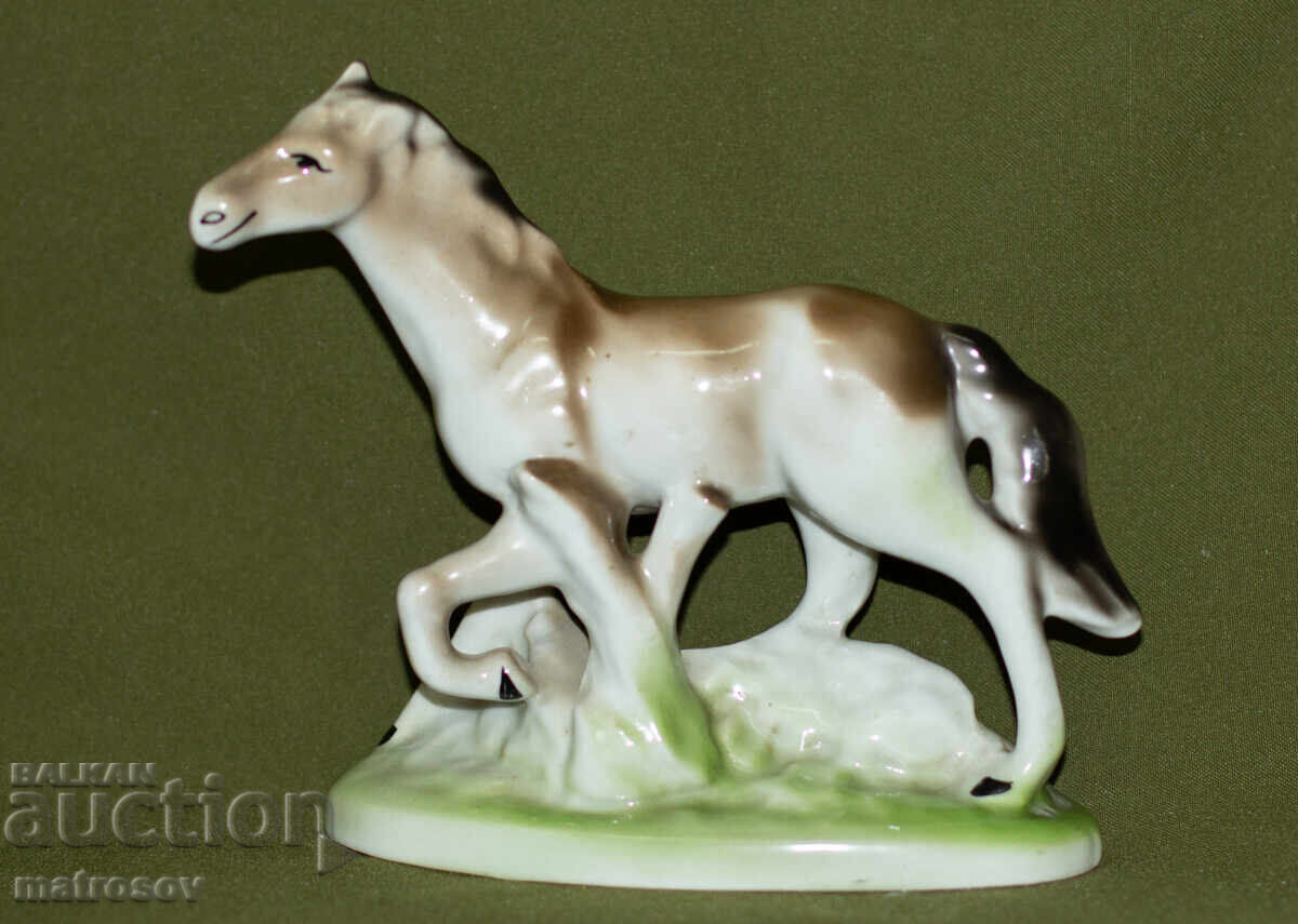 Decorative porcelain figurine of a galloping horse