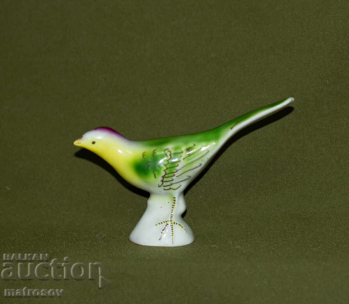 Old porcelain figurine of a singing bird with price 100.00 BGN | € 51.13 Old porcelain figurine of a singing bird with price 100.00 BGN | € 51.13