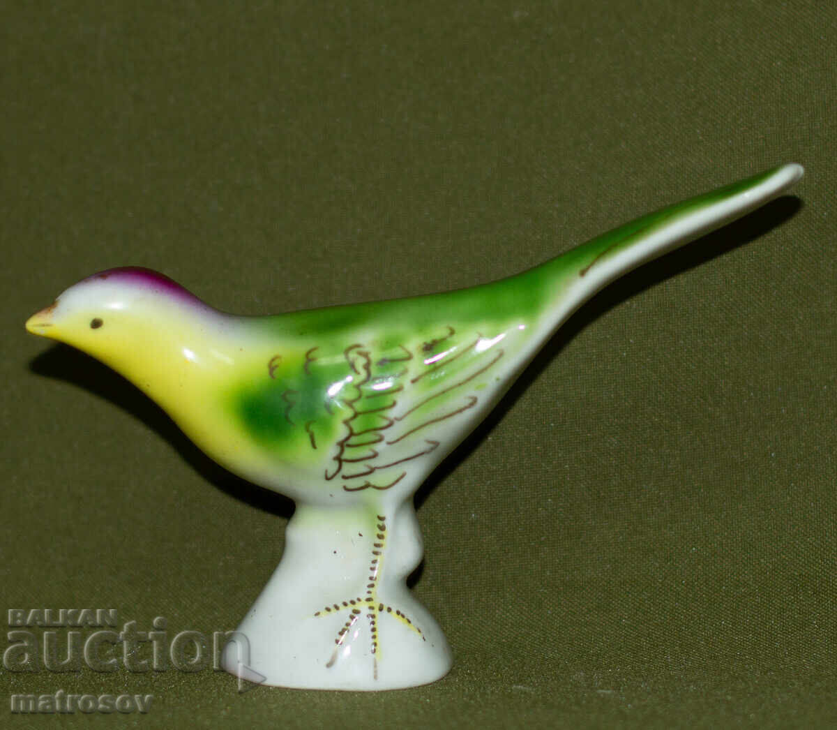 Old porcelain figurine of a singing bird Old porcelain figurine of a singing bird