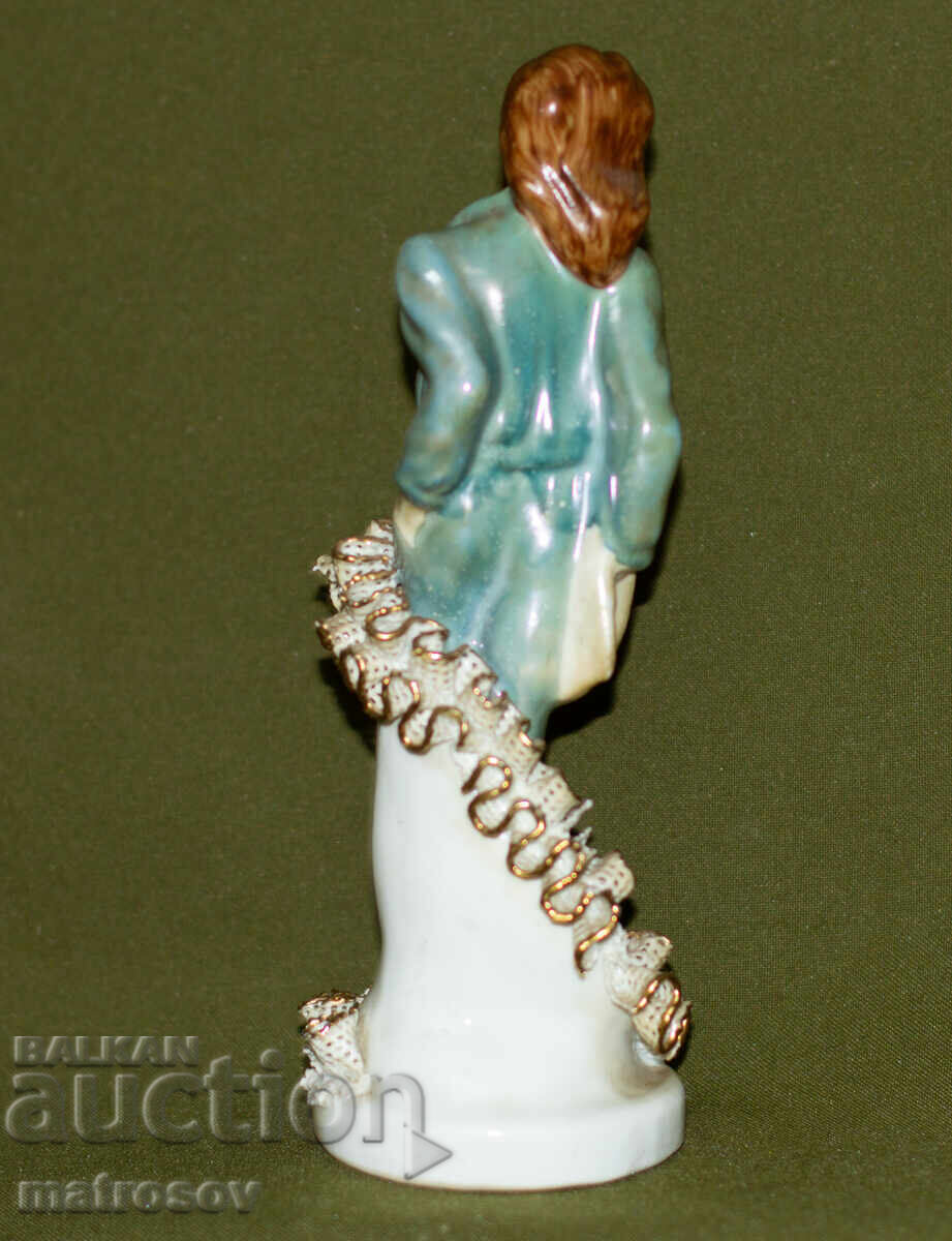 Auction  Romanian porcelain figurine of a woman