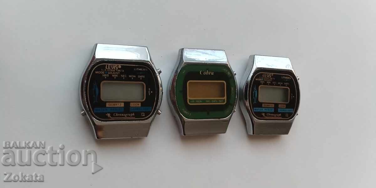 Auction  Lot of electronic watches. The two on the left work