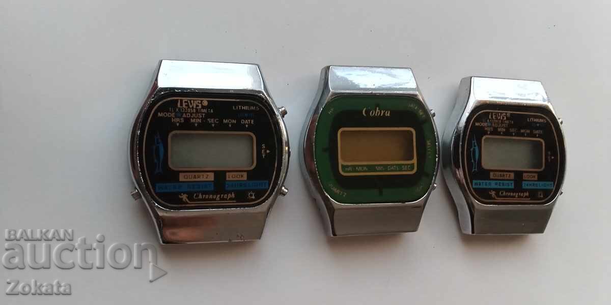 Lot of electronic watches. The two on the left work