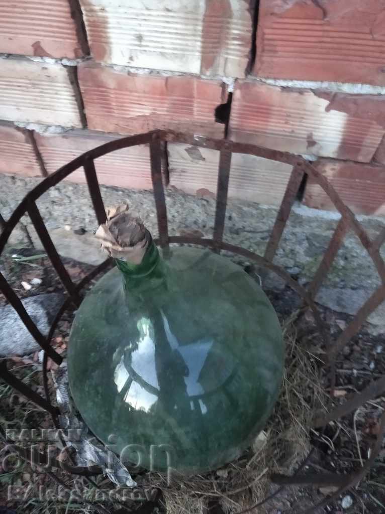 Large glass demijohn with a metal basket with price 42.00 BGN | € 21.47