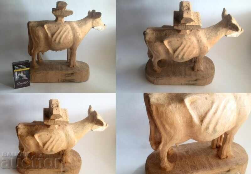 Delivery of Unfinished large wood carving of a cow figure