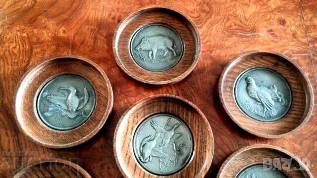 Auction  Coasters with hunting motifs
