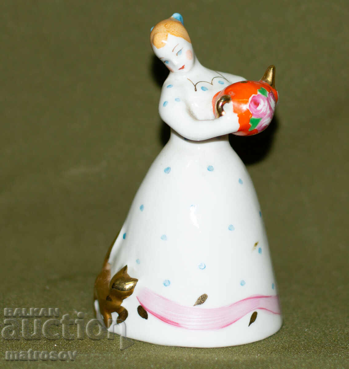 Russian porcelain figurine of a girl with a cat and a teapot