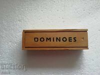 Old dominoes in a wooden box with a lid, board game