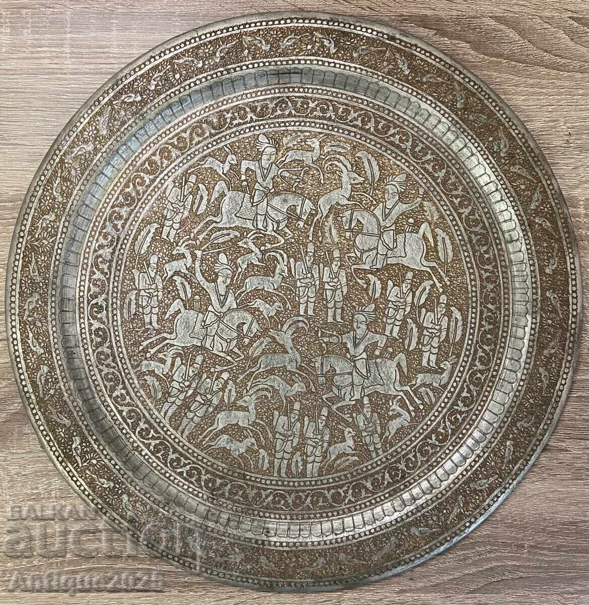 Ancient plate depicting scenes from horse races