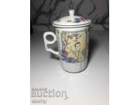 Cană asiatică, fabricată în Taiwan, Tatumg