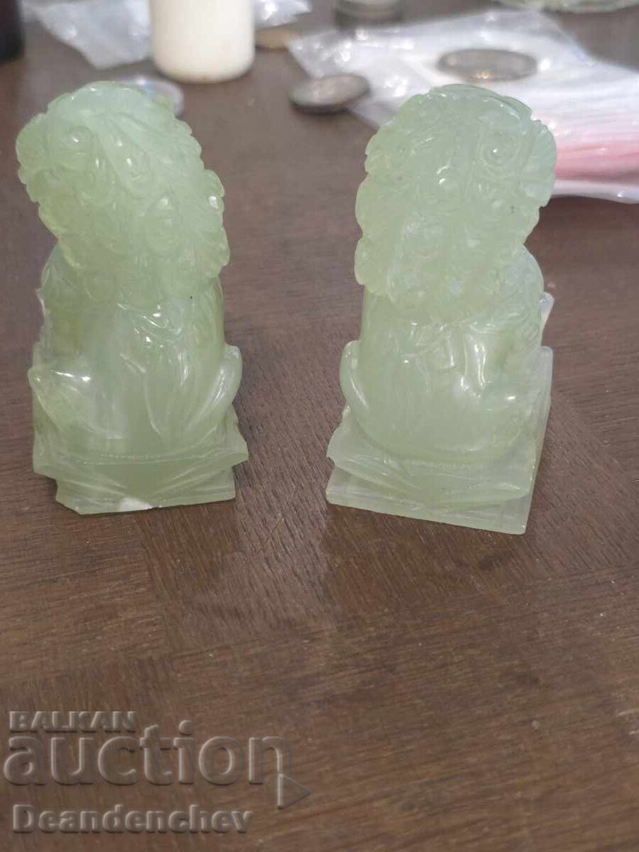 Auction  Pair of jade Foo dog sculptures
