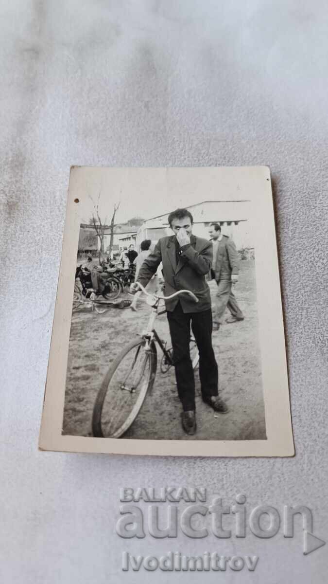 Photo of a Young Man with a Retro Bicycle 1965