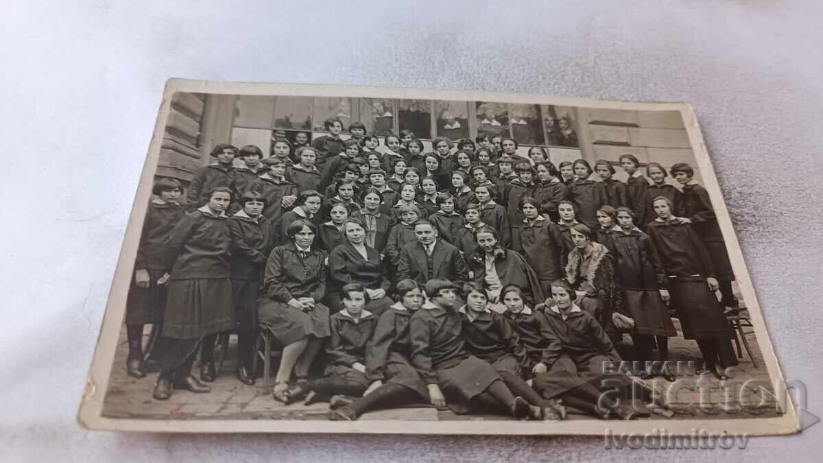Photo of Schoolgirls with their Teachers in the School Yard