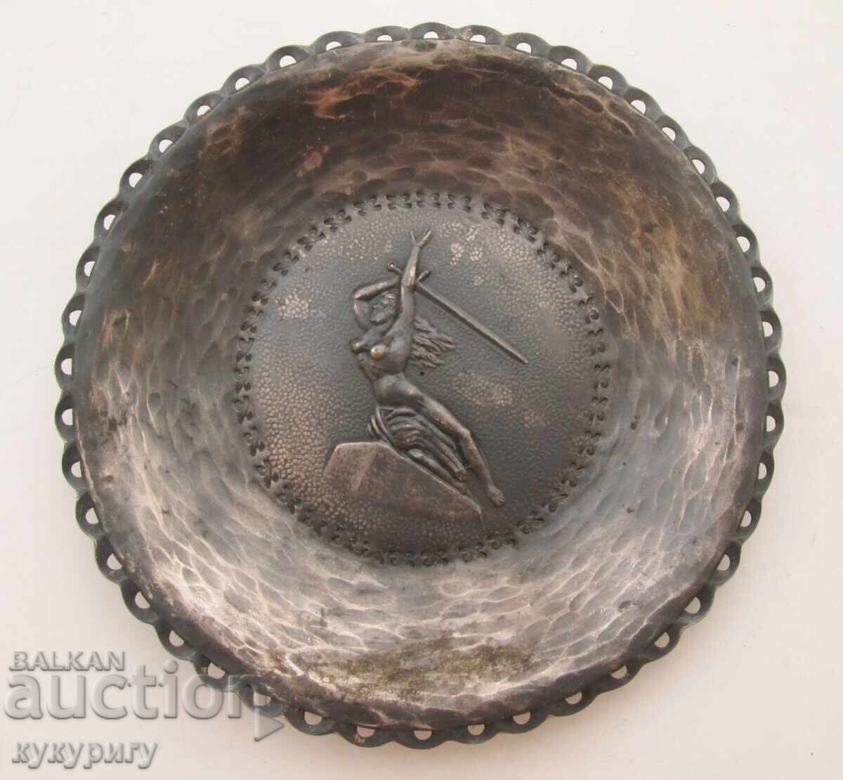 Old handmade metal wall plate with a mermaid Old handmade metal wall plate with a mermaid