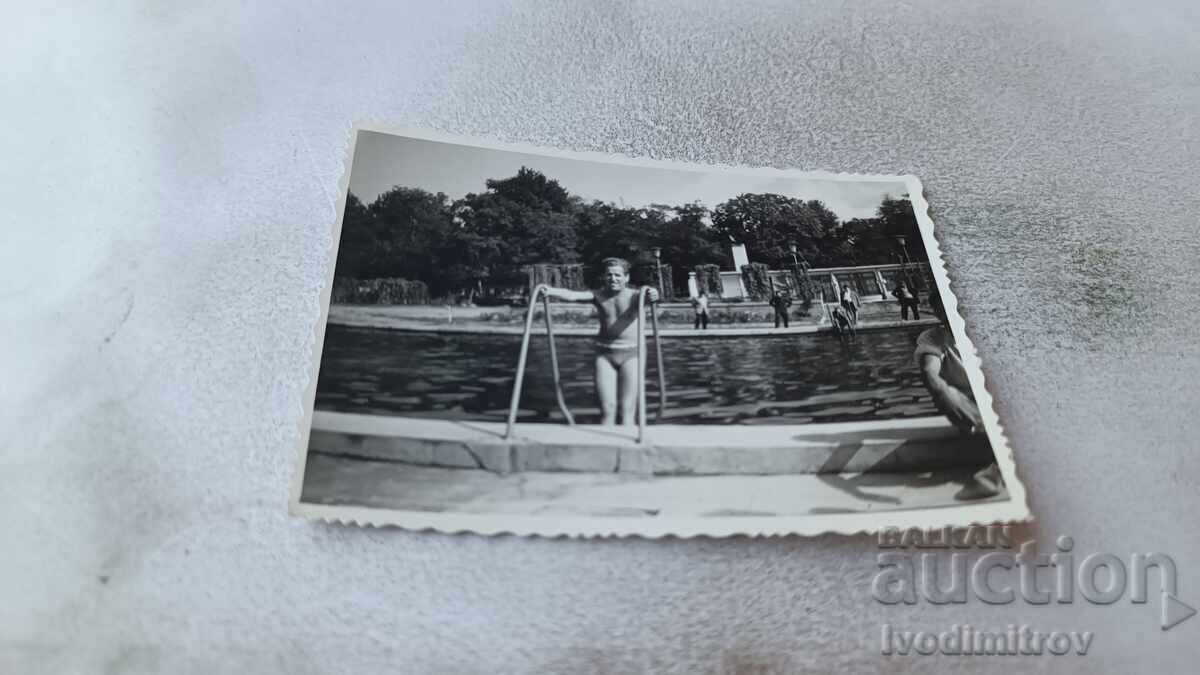 Photo of a Man on the Steps of a Swimming Pool Photo of a Man on the Steps of a Swimming Pool