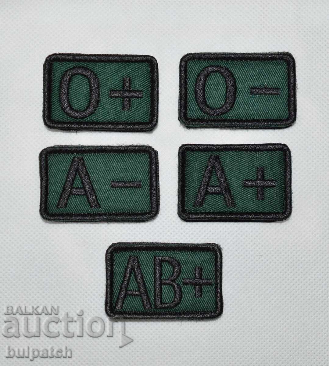 Self-adhesive blood type emblems for uniforms