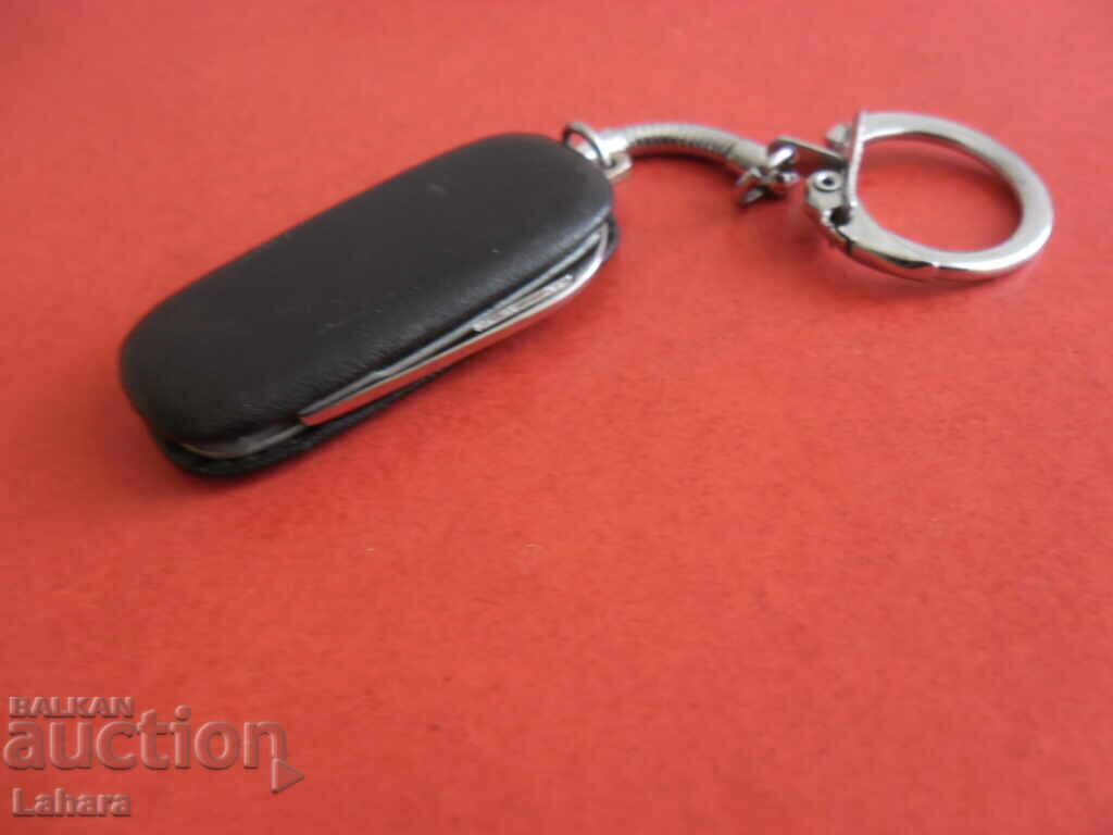 Delivery of Keychain, bottle opener knife Delivery of Keychain, bottle opener knife