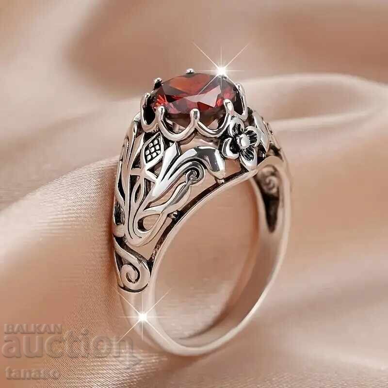 Ring with red garnet